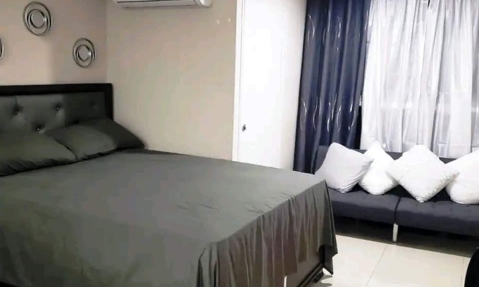 Portmore Apartment | Luxuriate poolside or on the private beach at this comfy studio apartment.