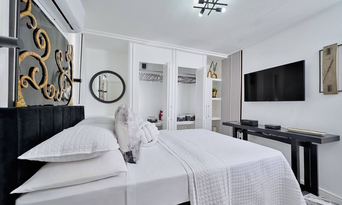 Kingstown Apartment | Luxurious 1 bedroom haven, modern kitchen moments from pristine black sand beach