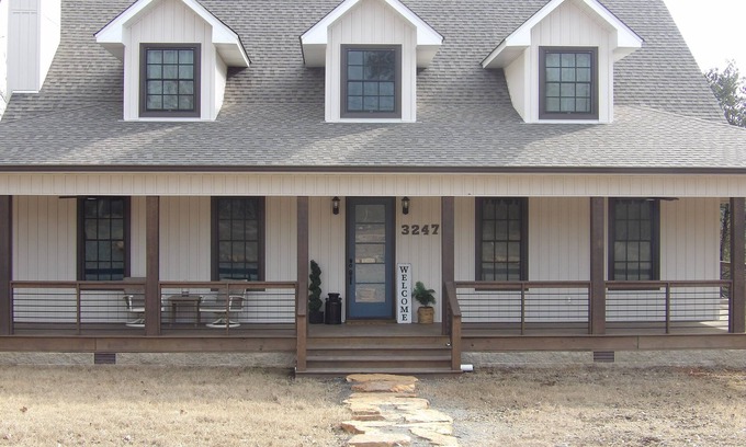 Drasco House | Luxurious 5-bedroom lakefront house with 3 master bedrooms & a wrap-around porch