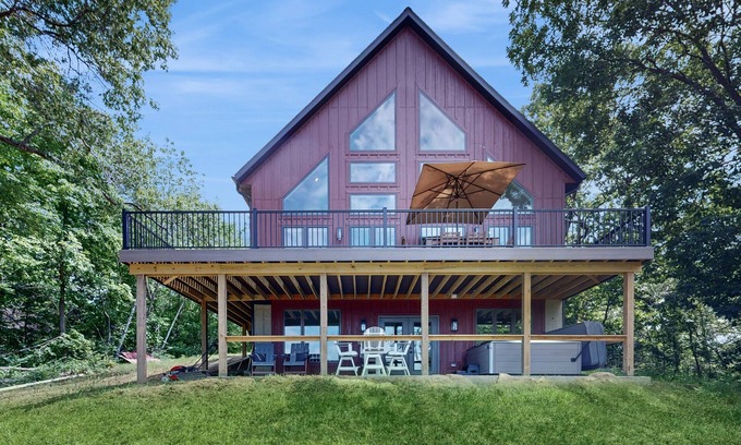 Eastman House | Luxurious home with hot tub, electric fireplace, and stunning views