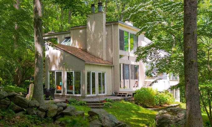 Old Lyme House | Luxurious midcentury modern glass house in the woods, chefs kitchen & great art