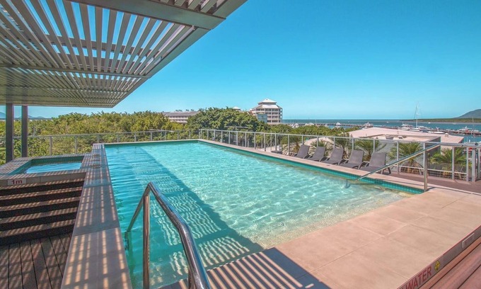 Cairns Central Business District Condo | Luxurious Waterfront Escape at Harbour Lights – Stunning Marina Views & Prime Location!