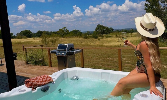 Stonewall Cabin | Luxury 1 BR cabin in the center of the Texas Wine Country with private porch, hot tub, gas grill and fire pit.