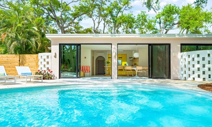 Central Beach House | Luxury 3BR, 3BA w/heated saltwater pool–10min walk to Beach, Shops, Restaurants!