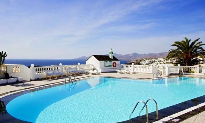 Puerto del Carmen Apartment | Luxury apartment, large private sun terrace, full UK TV, WiFi, immaculate pool.