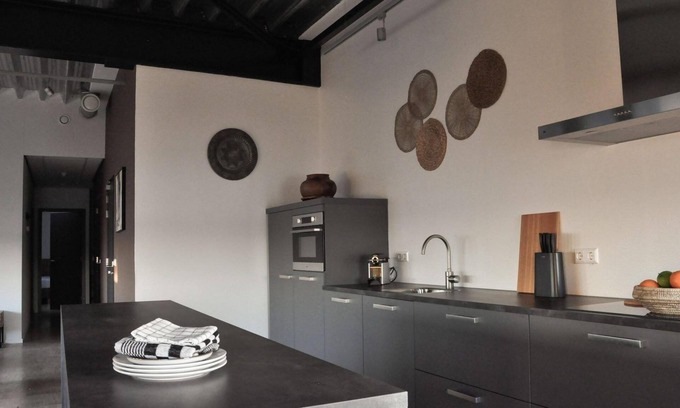 Stellendam House | Luxury apartment on the first floor with a private terrace and waterfront view.