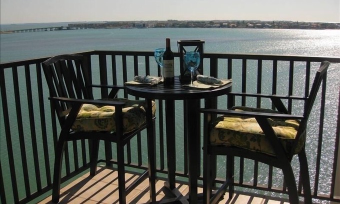 Isla del Sol Condo | LUXURY BAHIA POINTE WATERFRONT Condo/Panoramic Views! Dolphins, Manatee, More!
