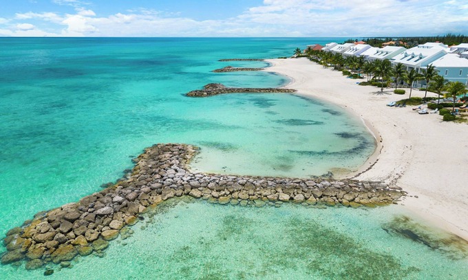 Palm Cay House | Luxury Beach side escape, steps from private beach, restaurant, marina, and café