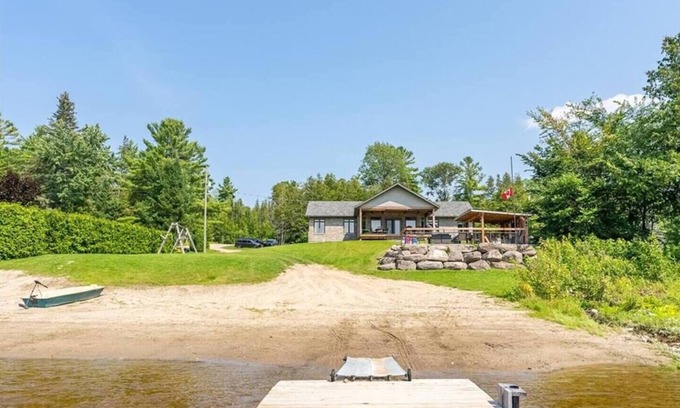 Whitewater Region House | Luxury Beachfront Cottage w Hot tub, Sauna & Bar