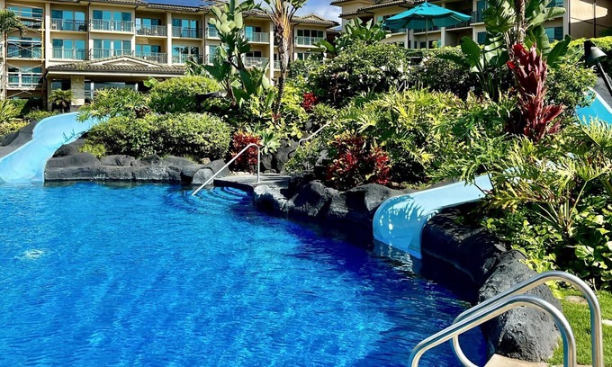 Kapaa Condo | Luxury Condo-2Waterslides, 3 hottubs, huge pool, BBQ’s, AC, WiFi & 3-75” TV’s