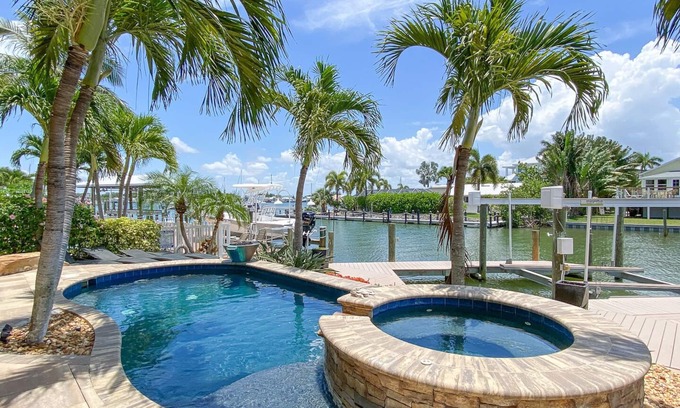 Clewiston House | Luxury Construction, Heated Pool on Canal, 3 Minute Walk to sugar sand of FMB!