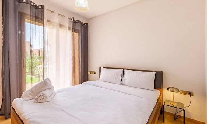 Menara Apartment | Luxury Garden-level Apartment With Poolside Serenity
