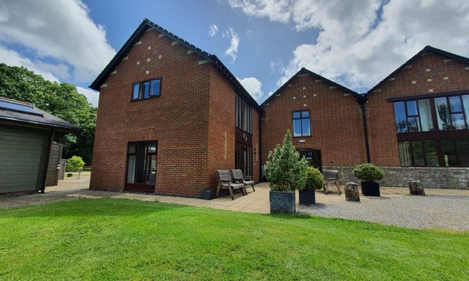 Woolland Cottage | Luxury barn conversion sleeping 16 with hot tub and ensuite bedrooms