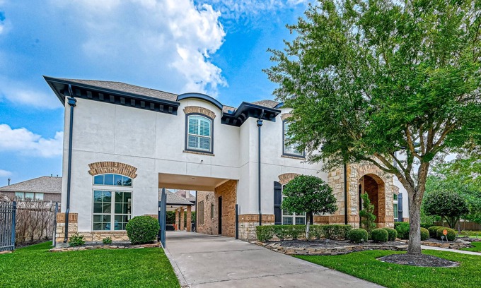 Cypress House | Luxury home with immaculate design, outdoor & chef's kitchen, home gym
