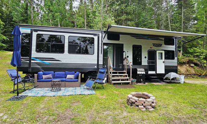 Waubun RV Rental | Luxury Lakefront Glamping near Itasca State Park + wifi, fit pit, & gas grill