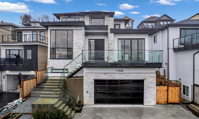 Surrey House | Luxury River View Home