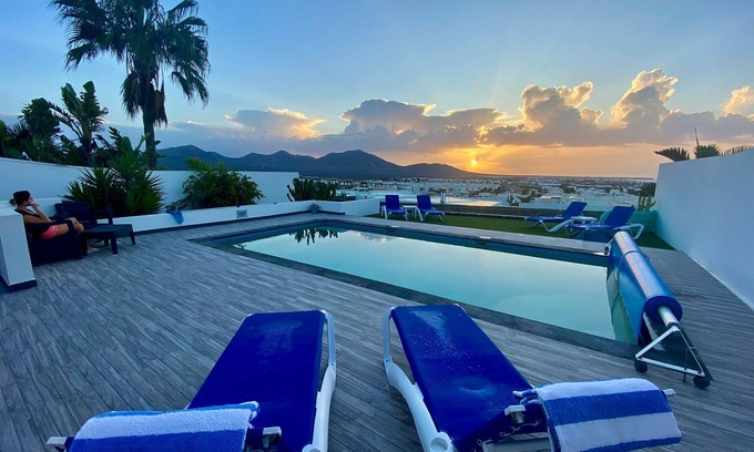 Playa Blanca Villa | Luxury villa - with a heated pool, hot tub, sea views, aircon, WiFi, UK TV