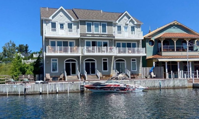 Alexandria Bay House | Luxury Waterfront Condo Downtown