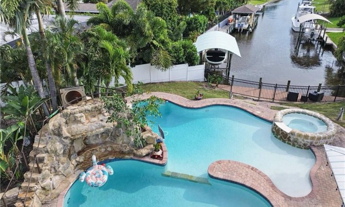 McGregor House | Luxury Waterfront Home w Pool HotTub and Waterslide. Off McGregor near Beaches