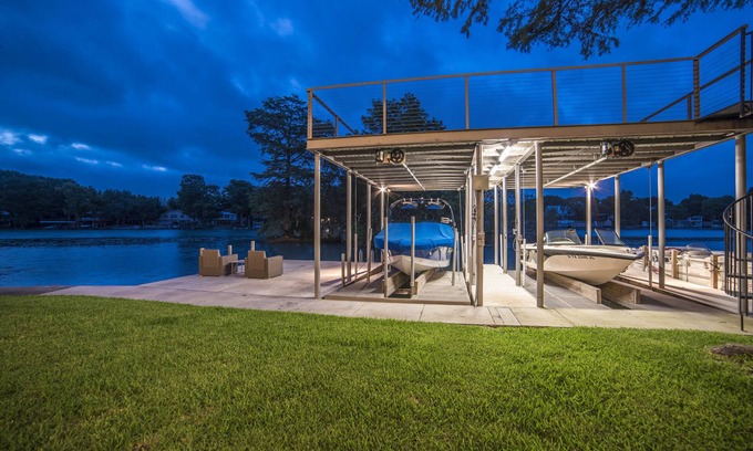 McQueeney House | Luxury Waterfront Lakehouse with Volleyball, Boat Dock, Fire Pit, 8 bedrooms