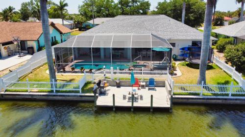 Fort Myers House | Luxury Waterfront Vacation Home with Dock and free heated Pool