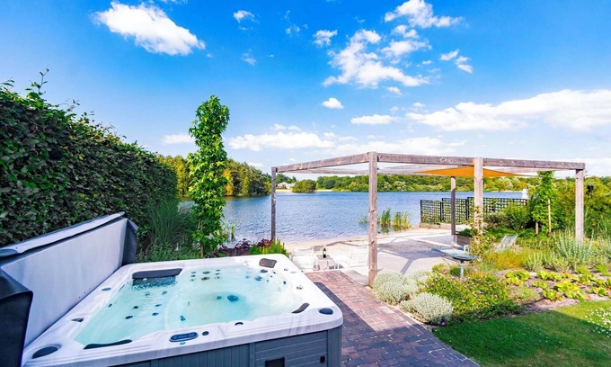 Westerhaar-Vriezenveensewijk House | Luxury wellness vacation home by the water with a private beach