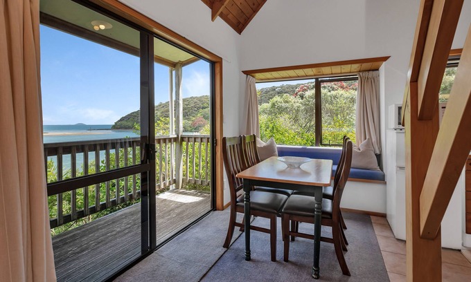 Cable Bay House | Macrocarpa Cottage - Cable Bay Holiday Home