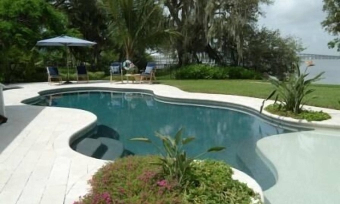 Tropic House | Magical Waterfront Home, Sunsets,Guest House, Beach, Dock, game room, Playground