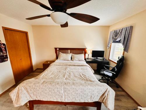 Airdrie House | Master Bedroom with attached bathroom