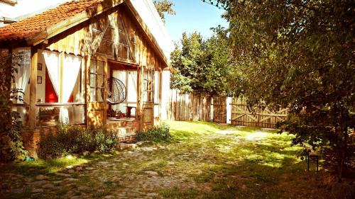 Wydminy House | Mazurskie Klimaty - niezależny, ogrodzony apartament z werandą