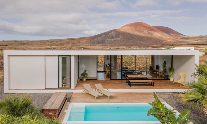 Lajares House | Minimalist house with heated pool and great volcano view