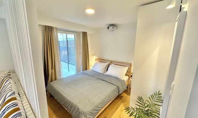 Olymbiaki Akti Apartment | Minimalist Seaside Apartment with Patio and Parking - Blue Zone Homes
