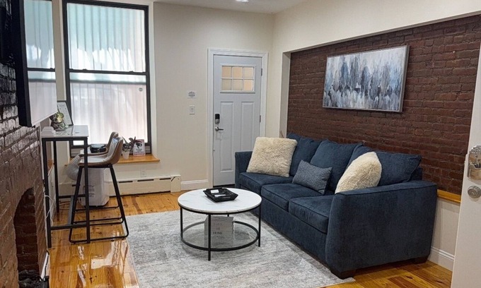 Upper Manhattan Apartment | Modern 1-bedroom Garden Apartment with Backyard, up to 25 mins to Times Square