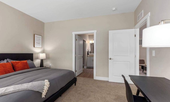 Grandville Apartment | Modern 16BR 16BA Condos w Garage and Patio