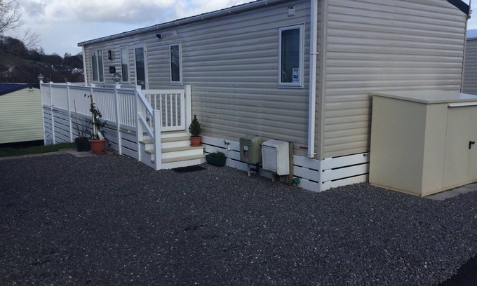 Dawlish Warren House | Modern 2 bed caravan with surrounding decking and patio; sleeps up to 6 people