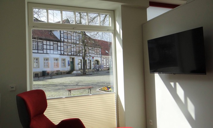 Bad Essen Apartment | Modern apartment with a fireplace in a listed half-timbered house on the market square