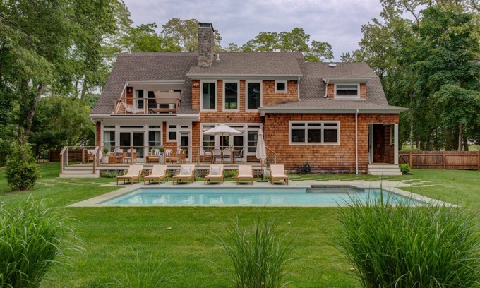 North Haven House | Modern Coastal Farmhouse style home with a private pool, open-floor plan,.