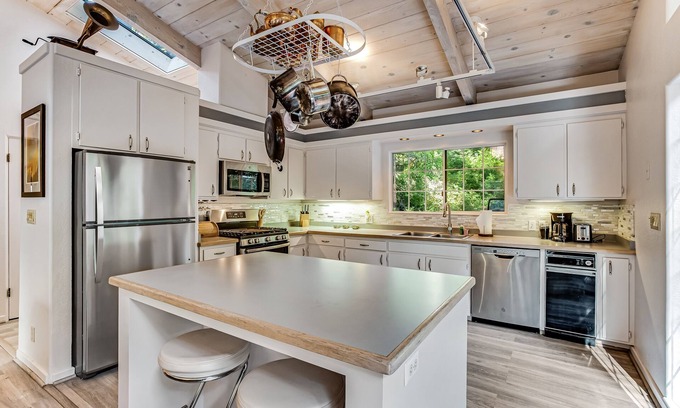 Anchor Bay House | Modern, Dog-Friendly Retreat with a Private Deck, Hot Tub, Fireplace, & Sun Room