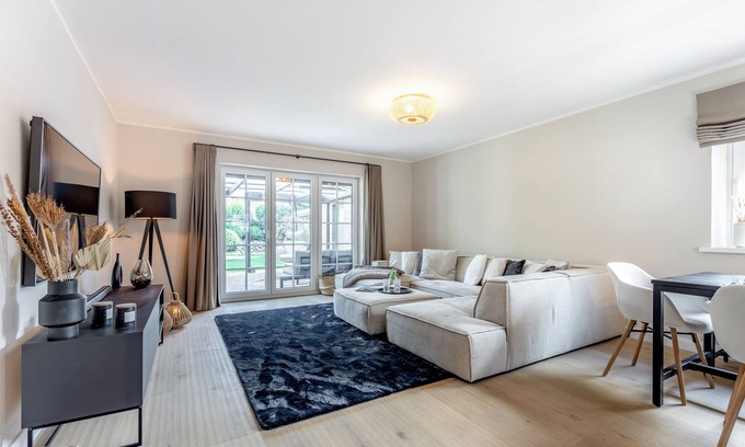 Sylt-Ost Apartment | Modern first floor apartment with spacious terrace and private garden