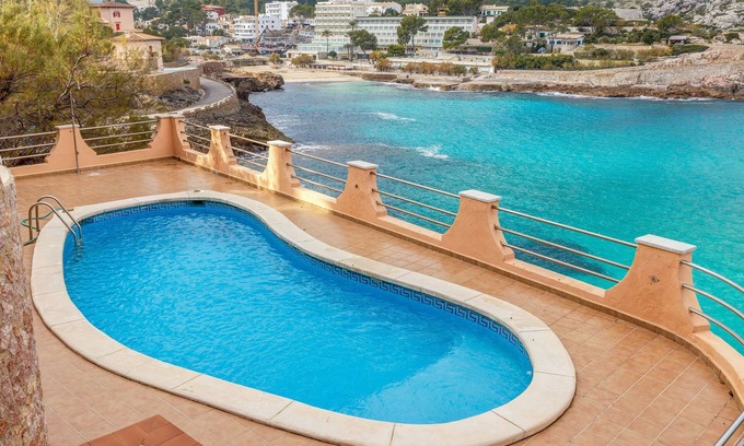 Cala Carbo Apartment | Modern Holiday Apartment with Sea View, Pool, Balconies, Air Conditioning and Wi-Fi