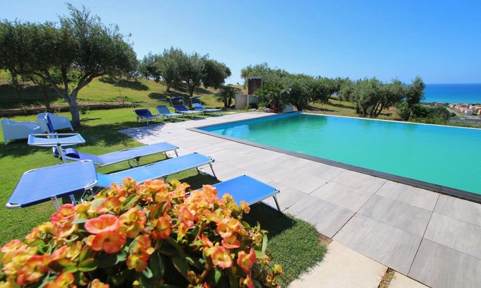 Campofelice di Roccella Villa | Modern Villa with Private Golf Practice, Pool, Garden, Terrace, Wi-Fi, Sea View