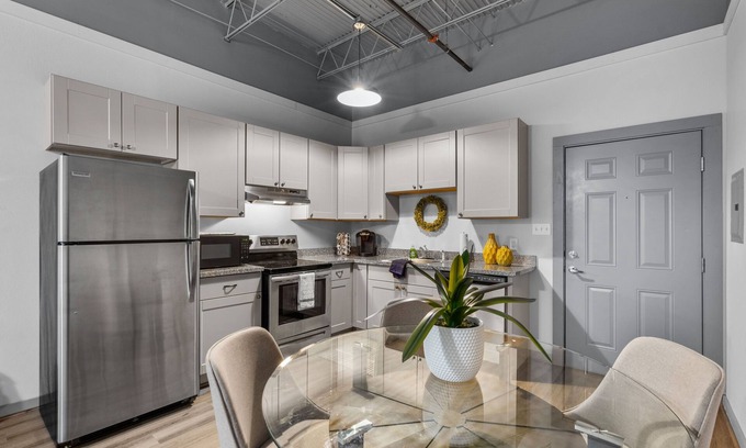 Baytown Apartment | Modern Loft Vibes Exposed Brick + Cozy Design