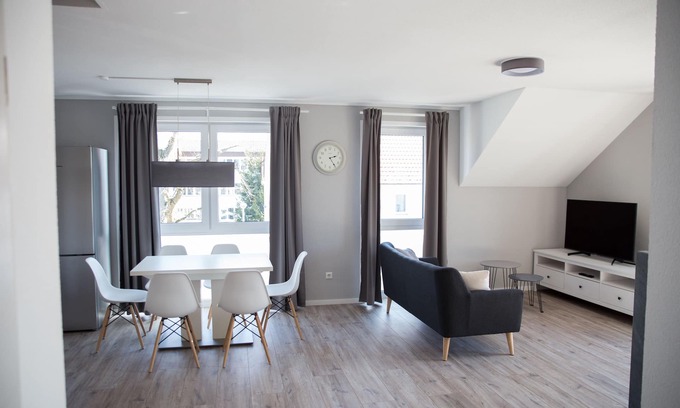 Trossingen Apartment | Modern new-build apartment with 35 sqm roof terrace + fireplace