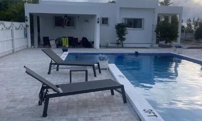 Cockburn Town House | Modern ocean villa with heated pool