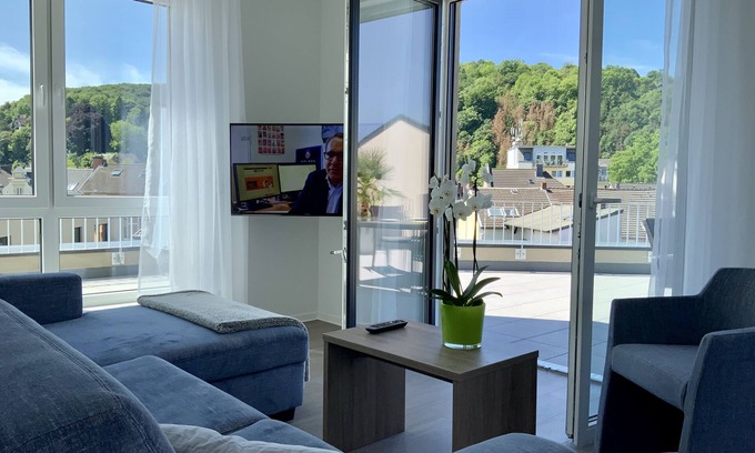 Remagen Apartment | Modern penthouse apartment with terrace over the roofs of Remagen