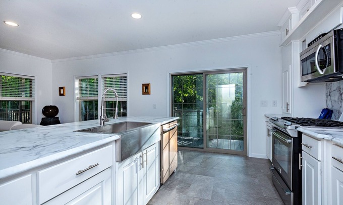 Galloway House | Modern waterfront fireplace in bedroom/bath jetted tub walk in shower no steps