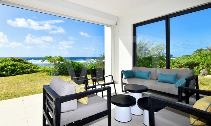 Poste Lafayette Villa | Modern White and Blue on the beach with pool