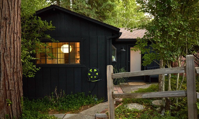 Hacienda House | Modern wooded gem with fast WiFi, charming deck, fireplace, W/D & central AC