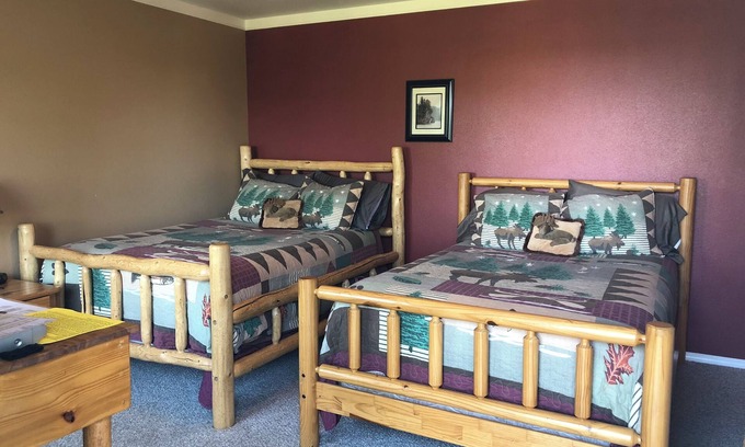 Cohoe Hotel | Moose Is Inn Room 2- Two double beds with a balcony view