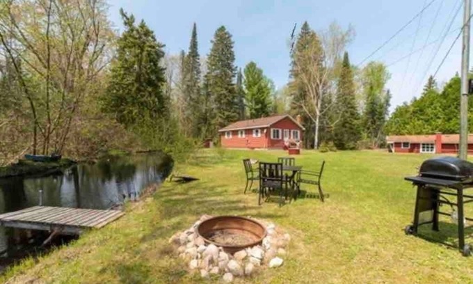Cheboygan Cabin | Mud Creek Cottage waterfront acre lot & game-room